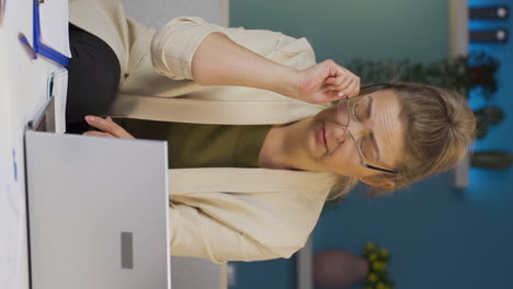 Vertical-video-of-Home-office-worker-woman-has-eye-pain.